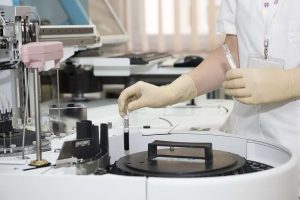 A Medical Personnel in a Laboratory | Breast Cancer Car Donations