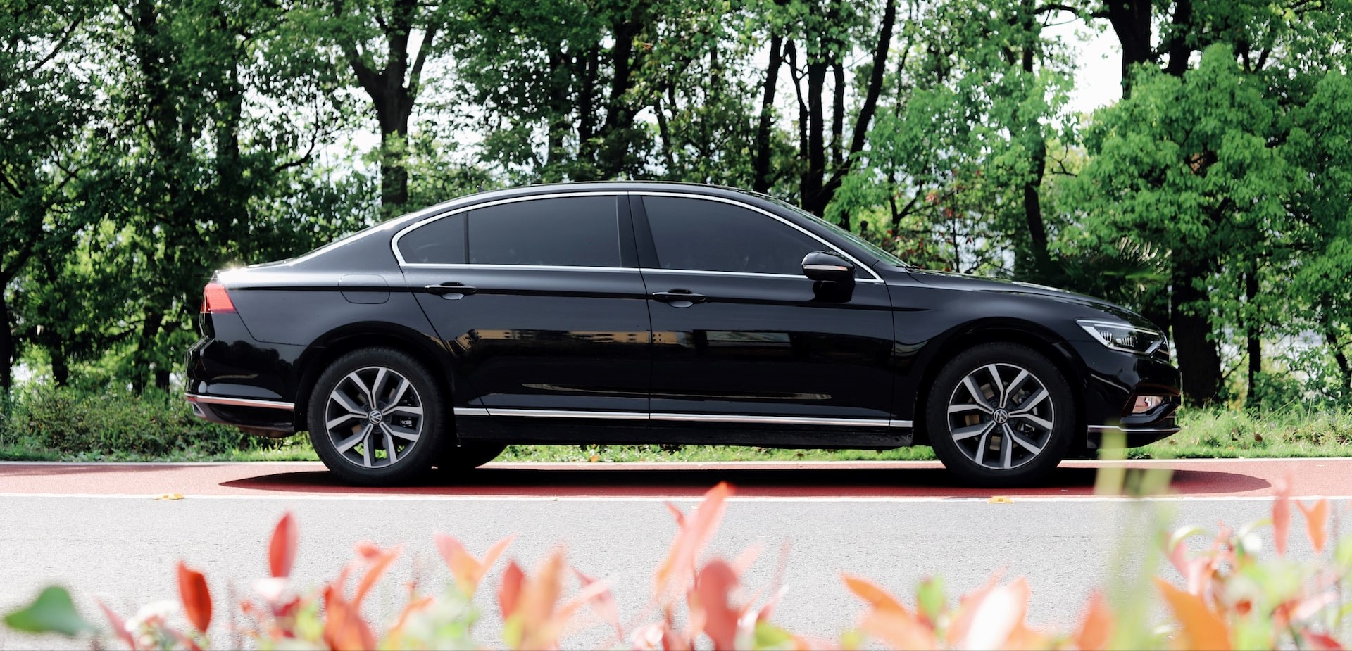Black sedan parked on the side of the road | Breast Cancer Car Donations
