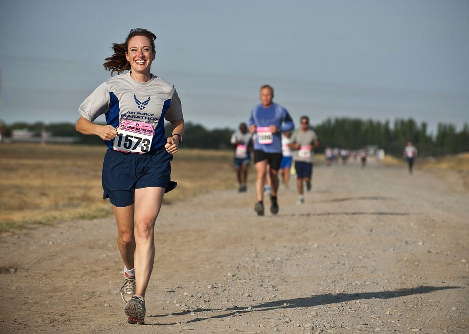 Woman engaged in National Running Day | Breast Cancer Car Donations
