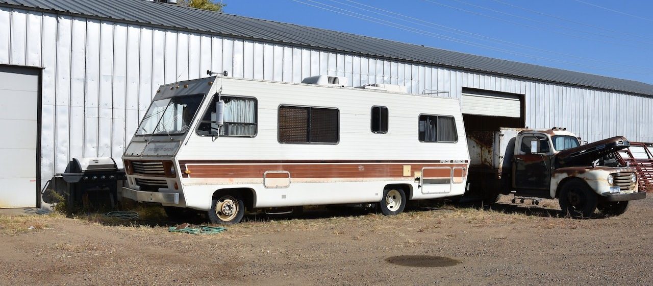 White rv with brown lining parked | Breast Cancer Car Donations