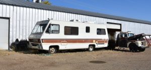 White rv with brown lining parked | Breast Cancer Car Donations