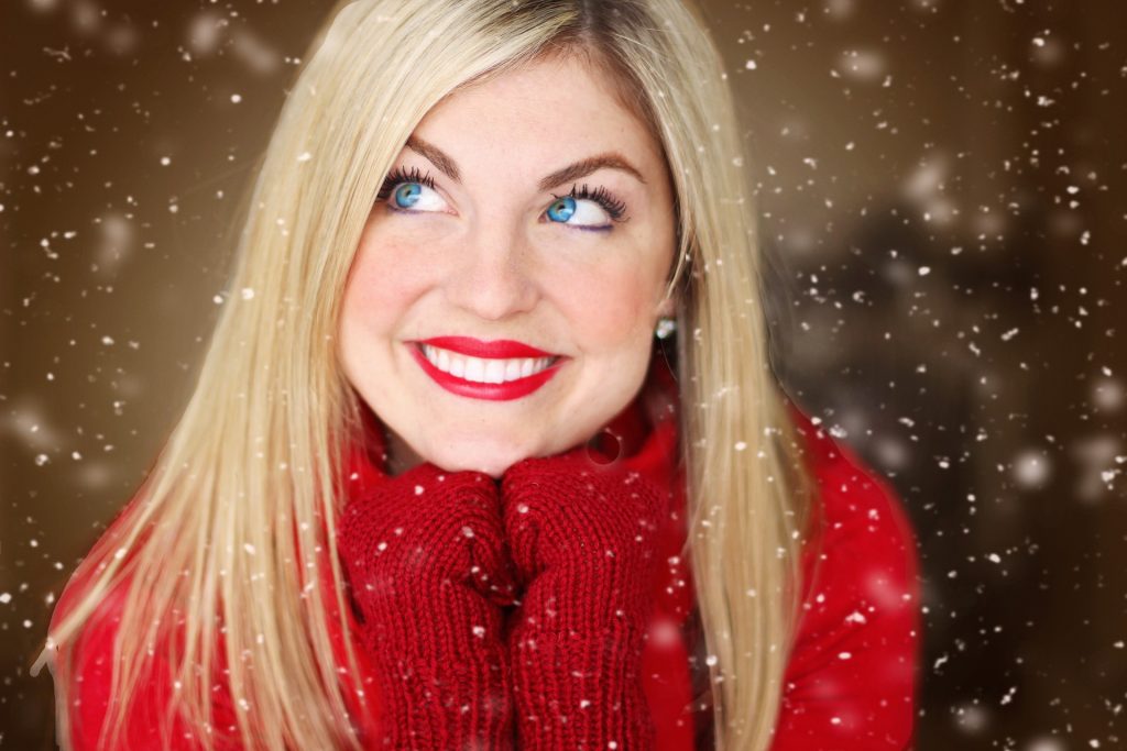 Woman Spreading Holiday Cheer | Breast Cancer Car Donations