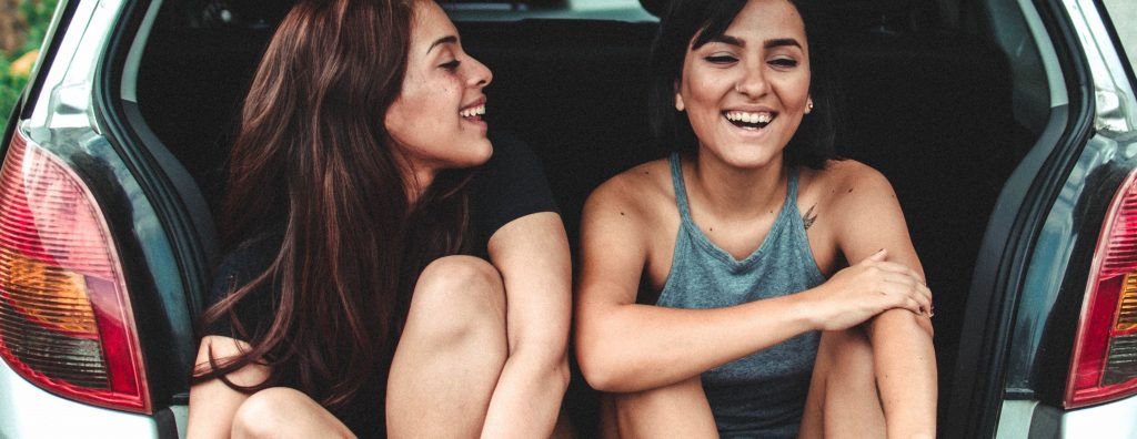 Friends Taking a Break on a Long Holiday Road Trip | Breast Cancer Car Donations