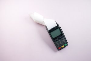 Payment Terminal on a Pink Surface | Breast Cancer Car Donations