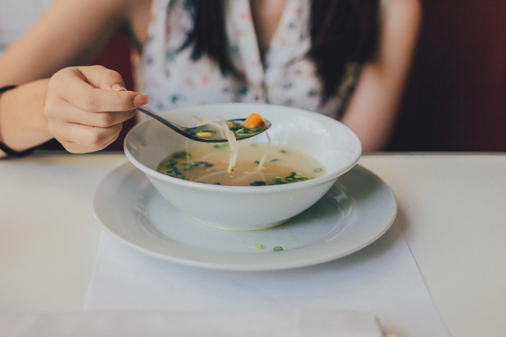 Woman with a Bowl of Soup | Breast Cancer Car Donations