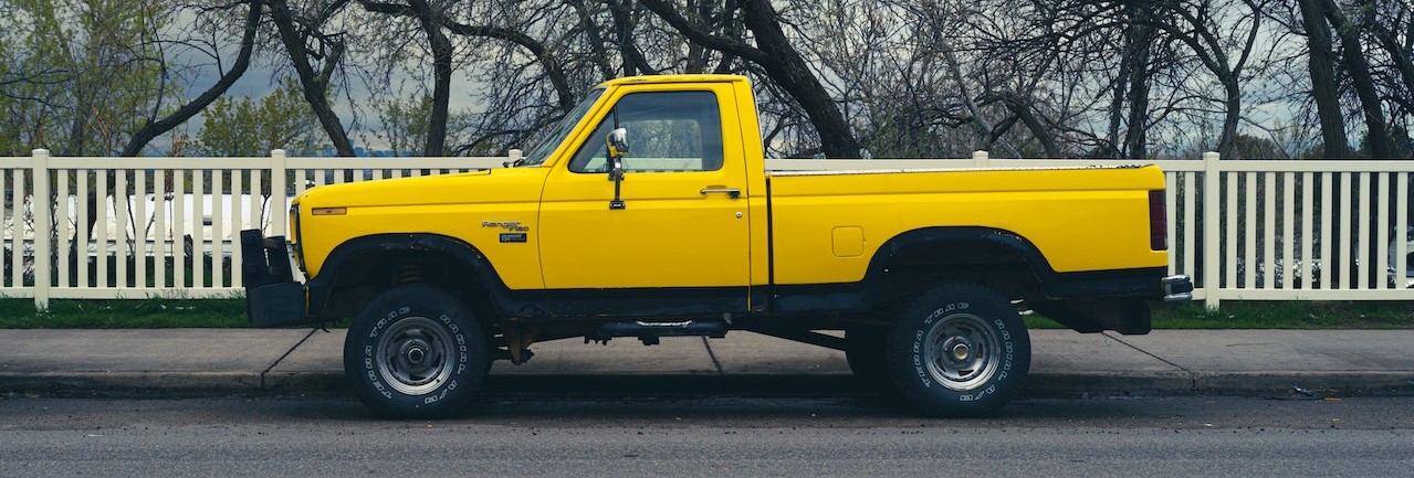 Yellow Truck Parked on the Road | Breast Cancer Car Donations