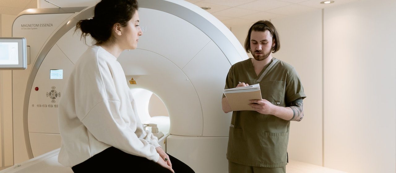 Photo Of Radiotech Looking Through Patient's Diagnosis | Breast Cancer Car Donations