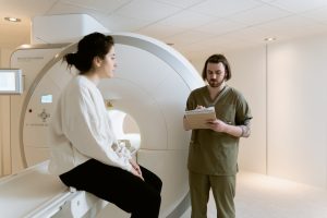 Photo Of Radiotech Looking Through Patient's Diagnosis | Breast Cancer Car Donations