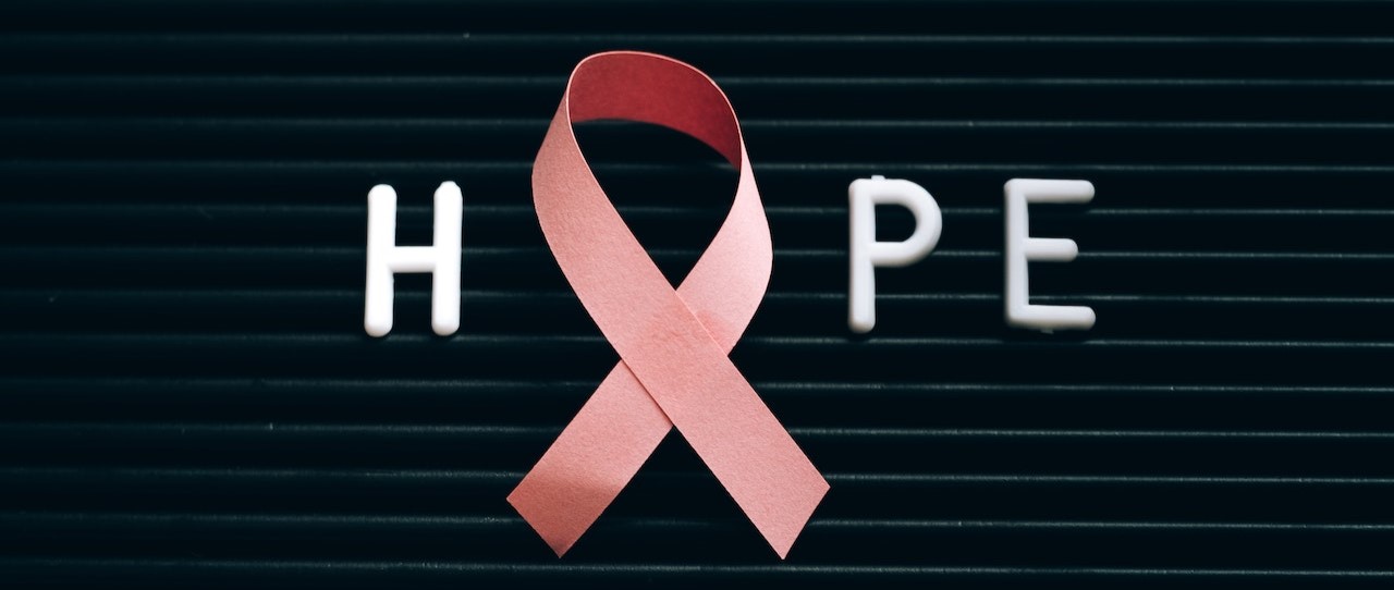 Pink Ribbon on a Letter Board with Message | Breast Cancer Car Donations