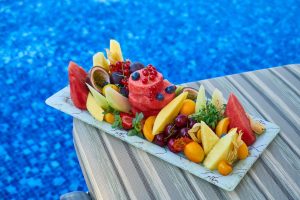 Sliced Tropical Fruits on a Platter | Breast Cancer Car Donations