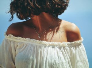 Woman with Christ the Redeemer Tattoo | Breast Cancer Car Donations