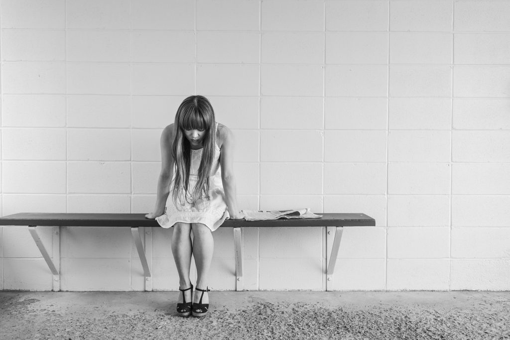 Worried Woman on a Chair | Breast Cancer Car Donations