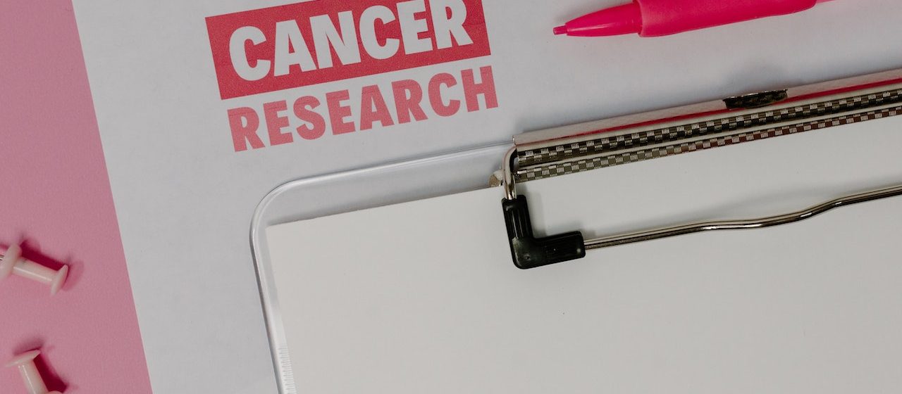 A Clipboard on Cancer Research Paper | Breast Cancer Car Donations