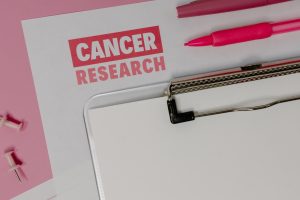 A Clipboard on Cancer Research Paper | Breast Cancer Car Donations