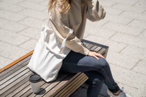 Close-Up Shot of a Person Sitting on Wooden Bench | Breast Cancer Car Donations