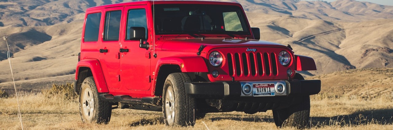 Red Jeep Wrangler Suv on Outdoor | Breast Cancer Car Donations