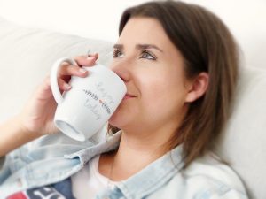 Woman Ejoying the Cup of Water | Breast Cancer Car Donations