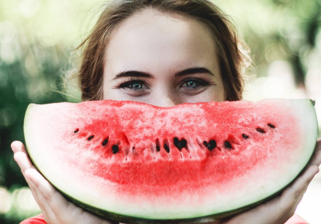 Woman Eating Watermelon | Breast Cancer Car Donations