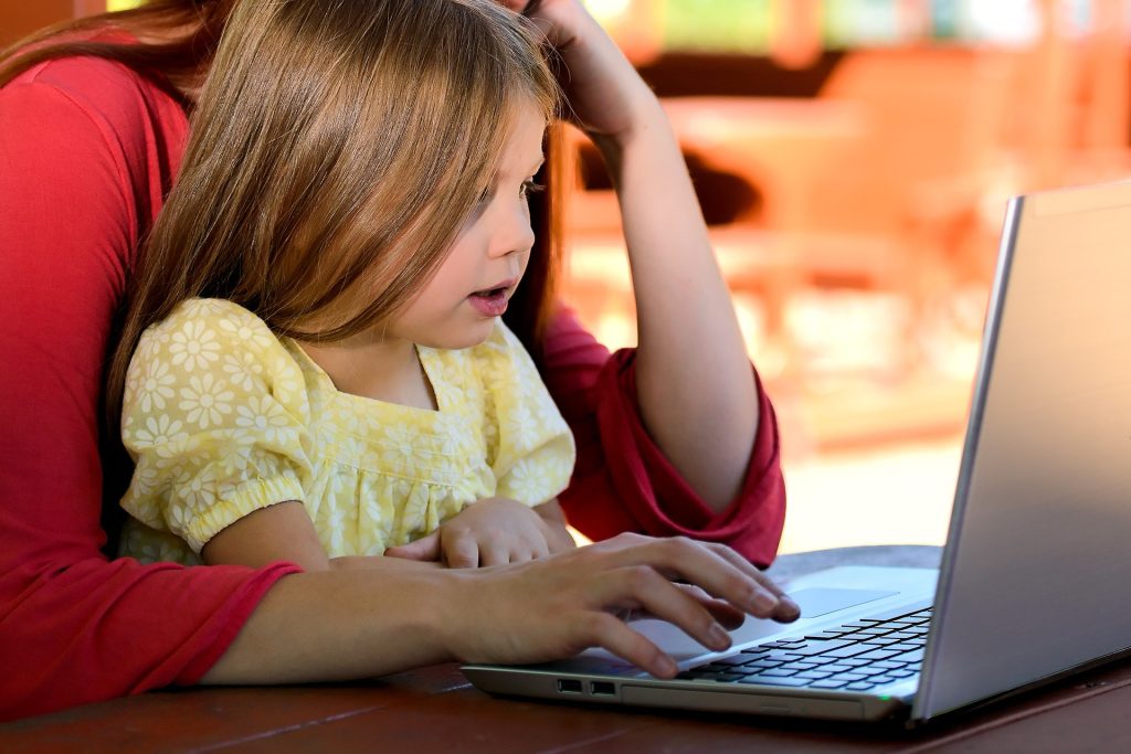 Mom and Daughter on a Computer | Breast Cancer Car Donations