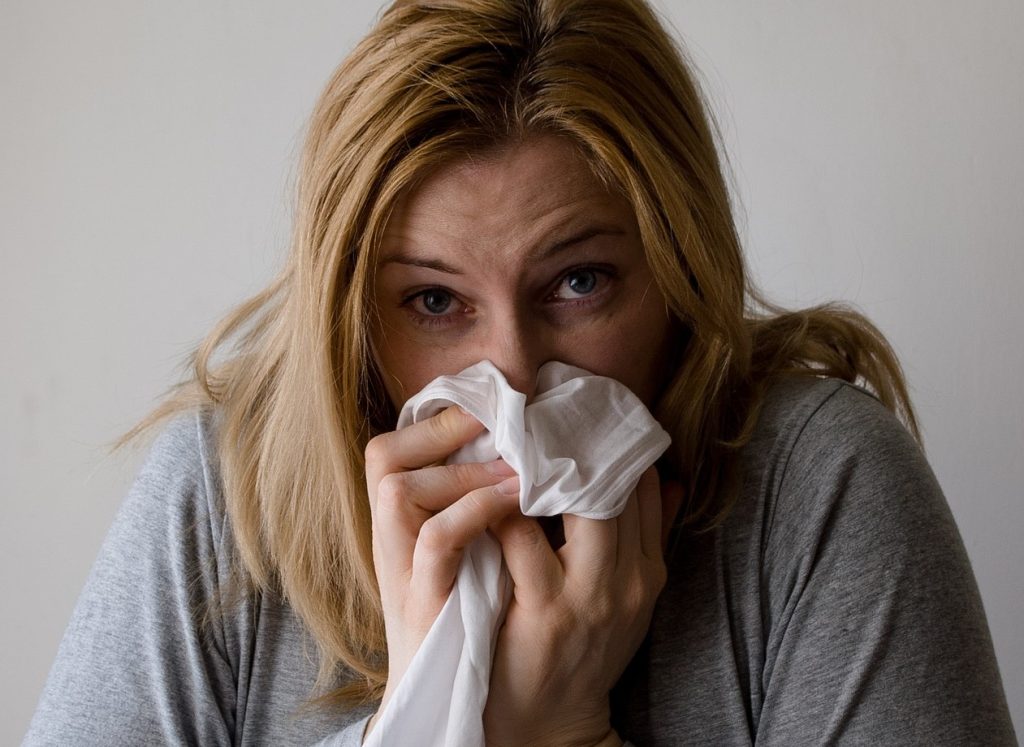 Sick Woman Sneezing | Breast Cancer Car Donations