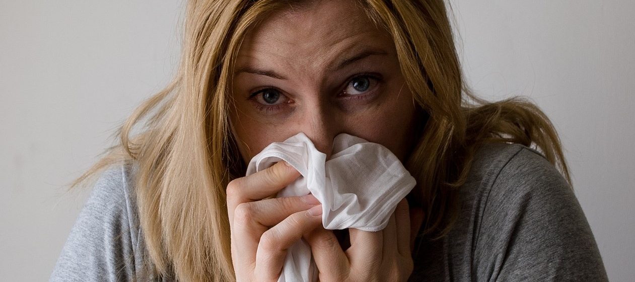 Sick Woman Sneezing | Breast Cancer Car Donations