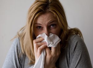 Sick Woman Sneezing | Breast Cancer Car Donations