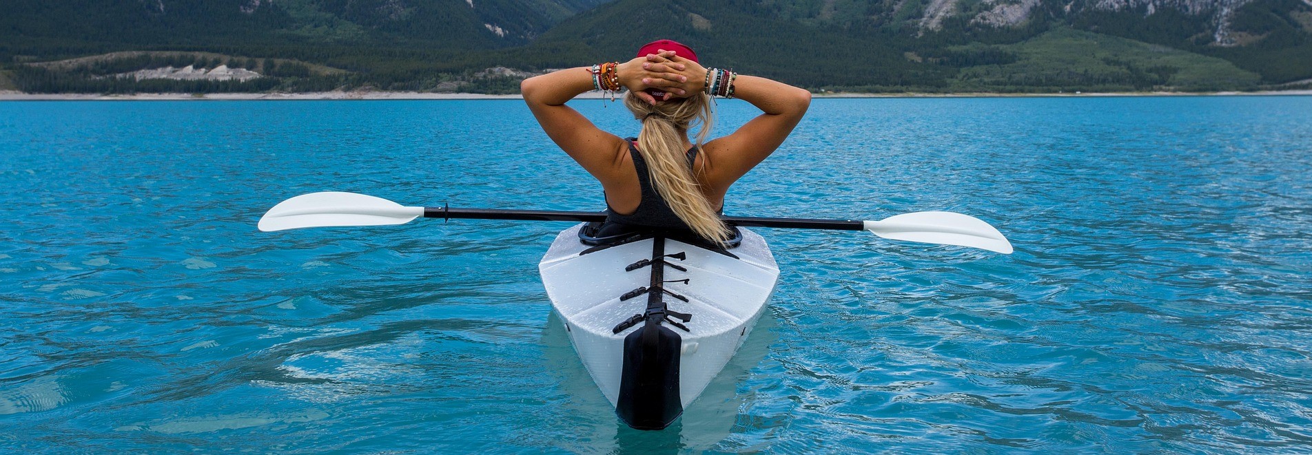 Woman Enjoying Summer Kayak | Breast Cancer Car Donations