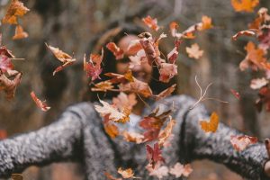 Woman Celebrating First Day of Autumn | Breast Cancer Car Donations