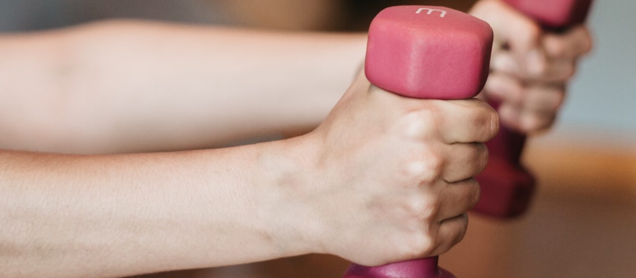 Woman with weights | Breast Cancer Car Donations