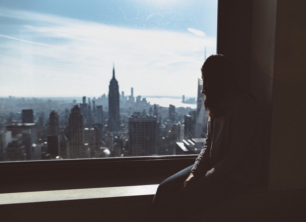 Sad Woman Overlooking the Window | Breast Cancer Car Donations