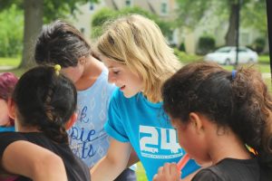 Woman Volunteer Enjoying with Kids | Breast Cancer Car Donations