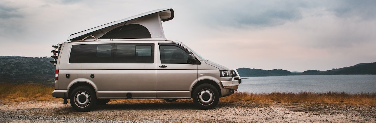 Van parked near tree | Breast Cancer Car Donations