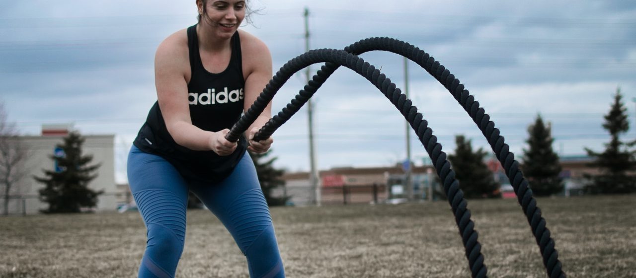 Woman exercising with ropes | Breast Cancer Car Donations