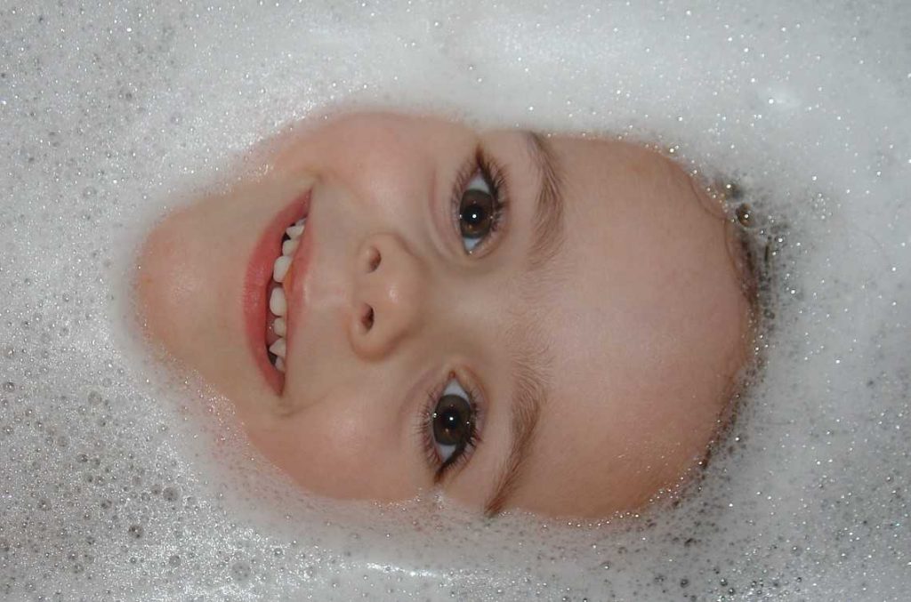Little Kid Enjoying Bubble Bath | Breast Cancer Car Donations