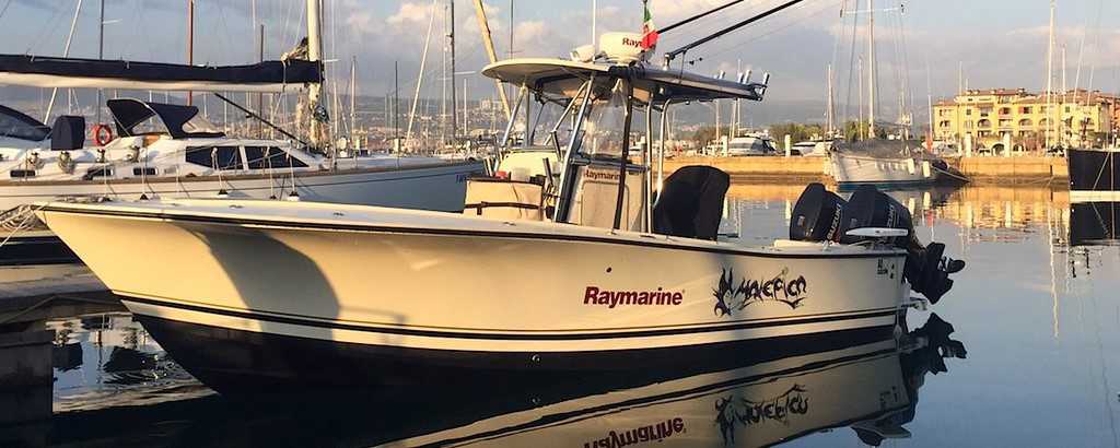 Center Console Boat Sitting on a Dock | Breast Cancer Car Donations