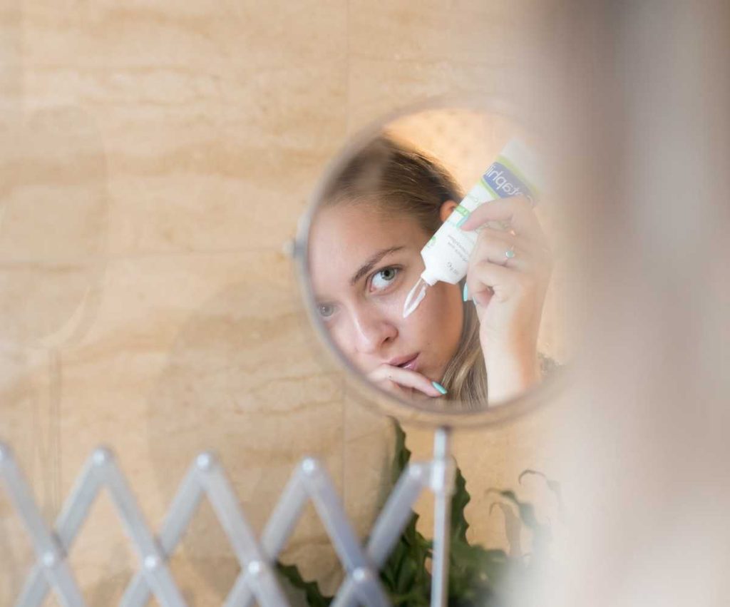 Woman Looking in the Mirror | Breast Cancer Car Donations