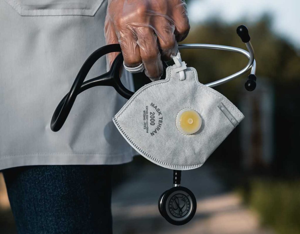 Doctor Carrying Face Mask | Breast Cancer Car Donations