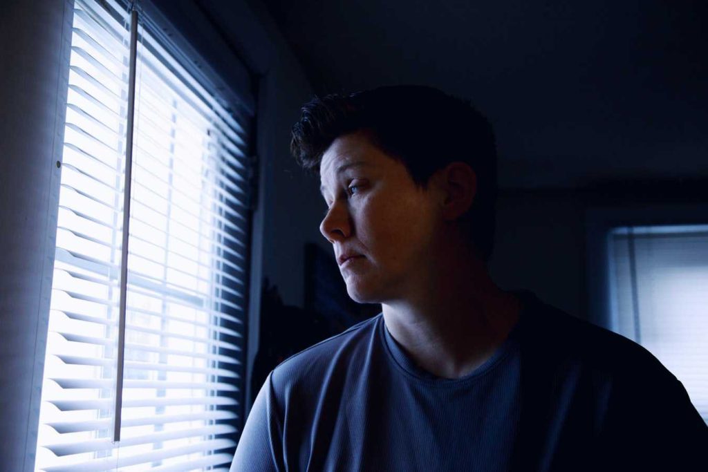 Woman Looking at the Window | Breast Cancer Car Donations