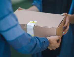 Person Receiving a Package | Breast Cancer Car Donations