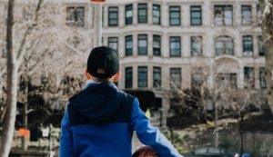 Kid Looking at His Closed School | Breast Cancer Car Donations