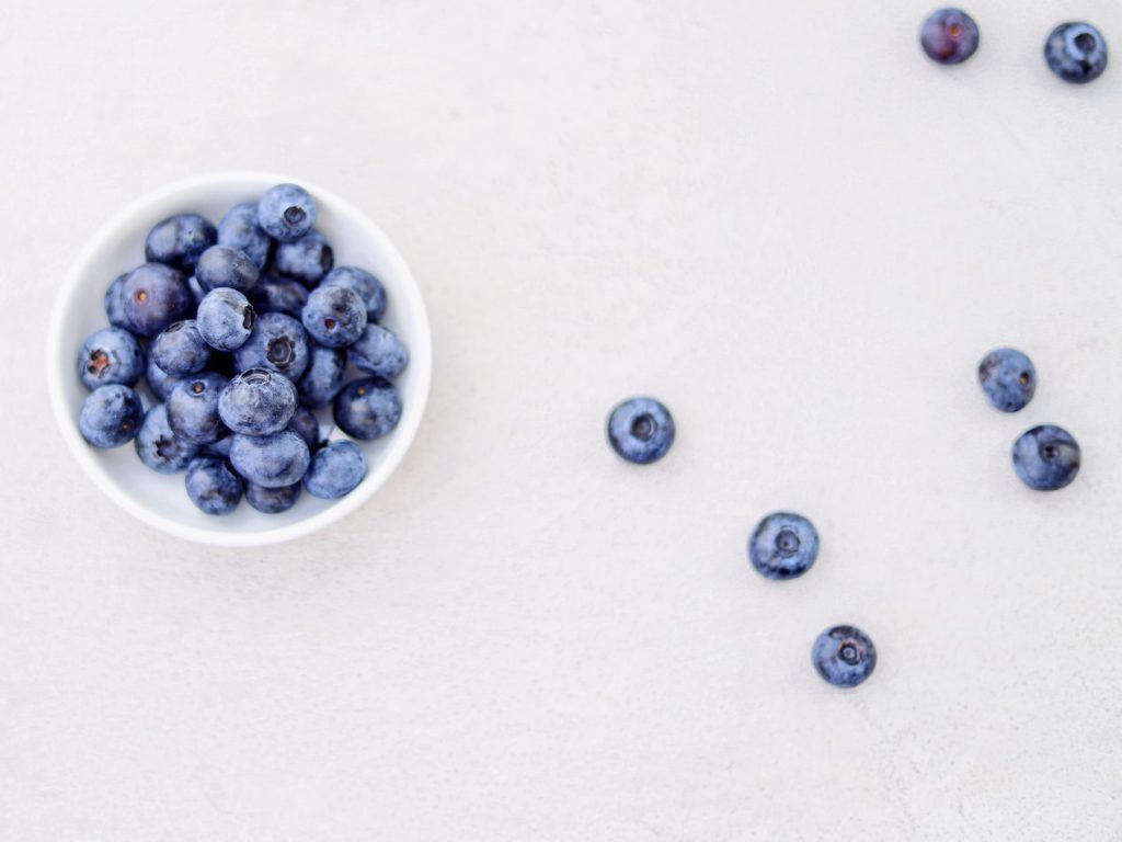 Blueberries on a White Table | Breast Cancer Car Donations