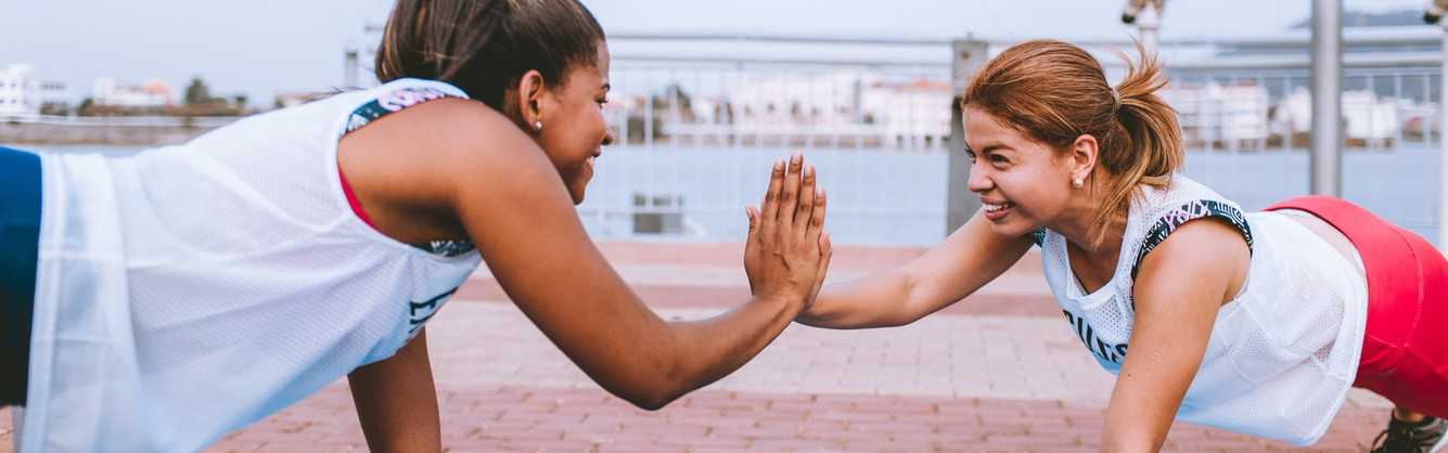 Women Doing Push Ups Together | Breast Cancer Car Donations