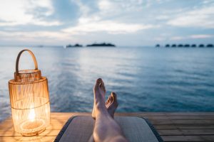 Person Relaxing at the Beach | Breast Cancer Car Donations