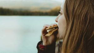 Woman Enjoying a Smore | Breast Cancer Car Donations