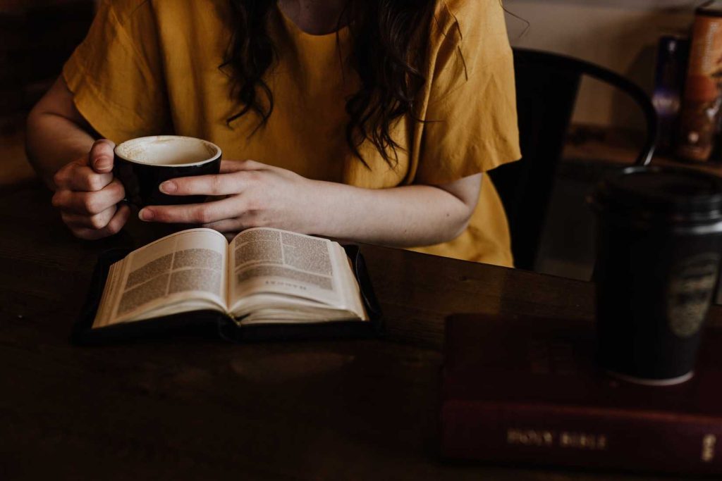 Person Having Coffee While Reading | Breast Cancer Car Donations