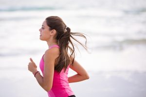 Woman In Pink Shirt Running | Breast Cancer Car Donations