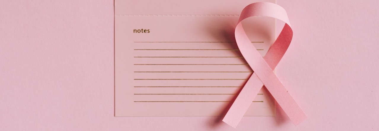 Close-Up Shot of a Pink Ribbon on a Calendar | Breast Cancer Car Donations