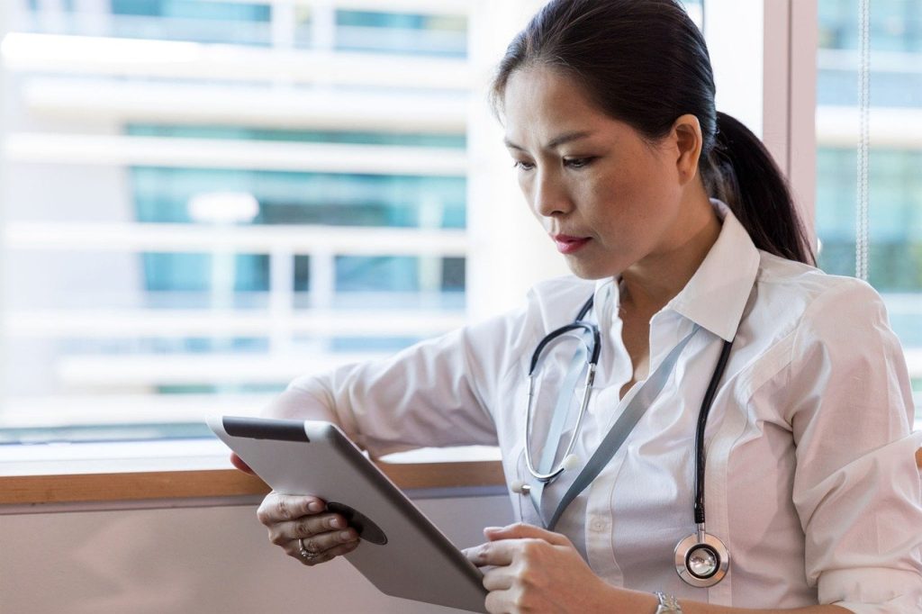 Doctor Checking Patient's Profile | Breast Cancer Car Donations