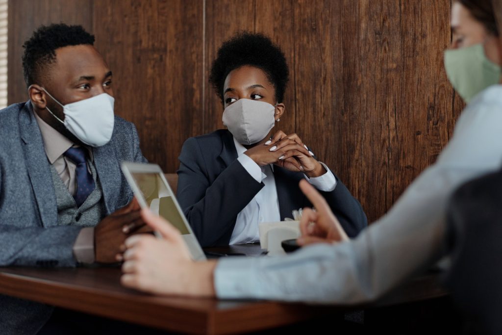 People in a Meeting Wearing Face Masks | Breast Cancer Car Donations