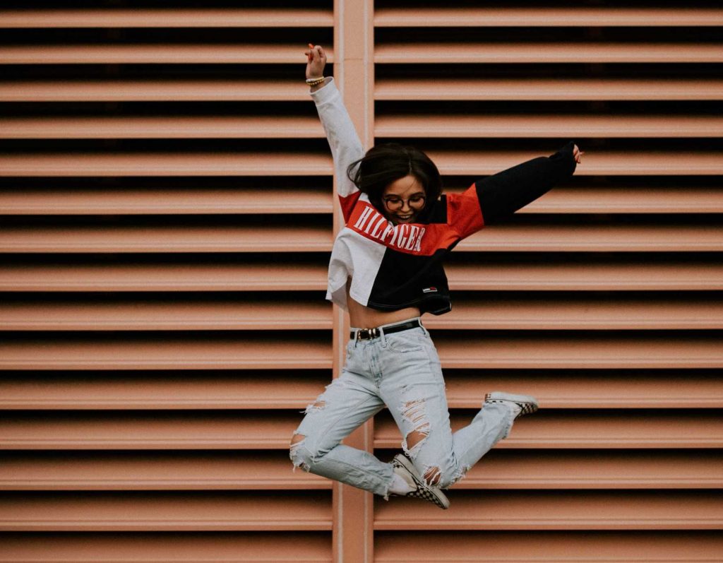 Person Jumping with Happiness | Breast Cancer Car Donations